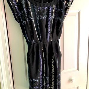 Black stylish dress featuring zipper down back